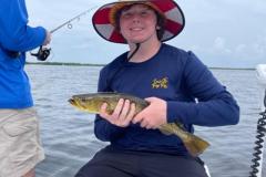 Boy-Holding-A-Spotted-Seatrout-On-A-Boca-Grande-Fishing-Charter